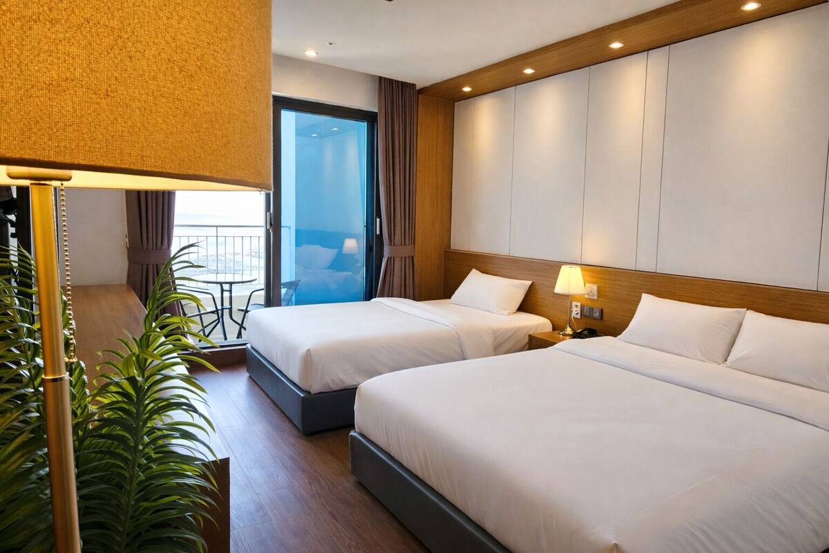 Habitación Deluxe con 2 camas individuales, vista al océano | Ropa de cama de alta calidad y escritorio 