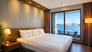 Premium bedding, desk, laptop workspace, blackout curtains