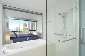 Separate tub and shower, deep soaking tub, hair dryer, towels