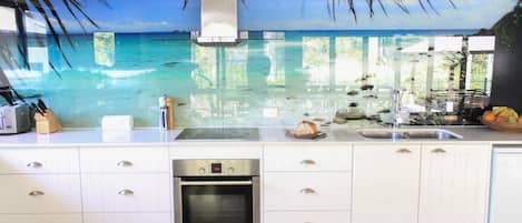 Full-size fridge, microwave, stovetop, coffee/tea maker