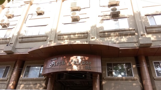 The Hotel Arch Manor DIX with a prominent entrance and multiple windows. - Hotel Arch Manor Deluxe (Bhopal)