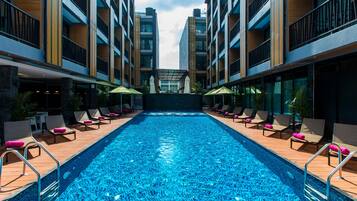 Outdoor pool, open 7 AM to 8 PM, pool loungers