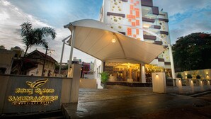 A boutique hotel entrance with a covered walkway and a sign indicating the name 'Samudramysore'. - Samudra Mysore (Mysore)