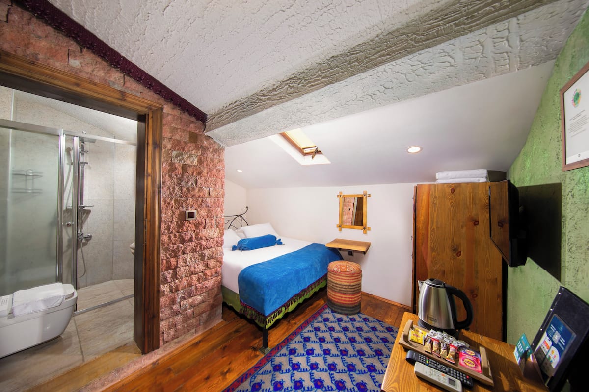 Aravan Standard Roof Floor Room | Premium bedding, down duvets, minibar, in-room safe