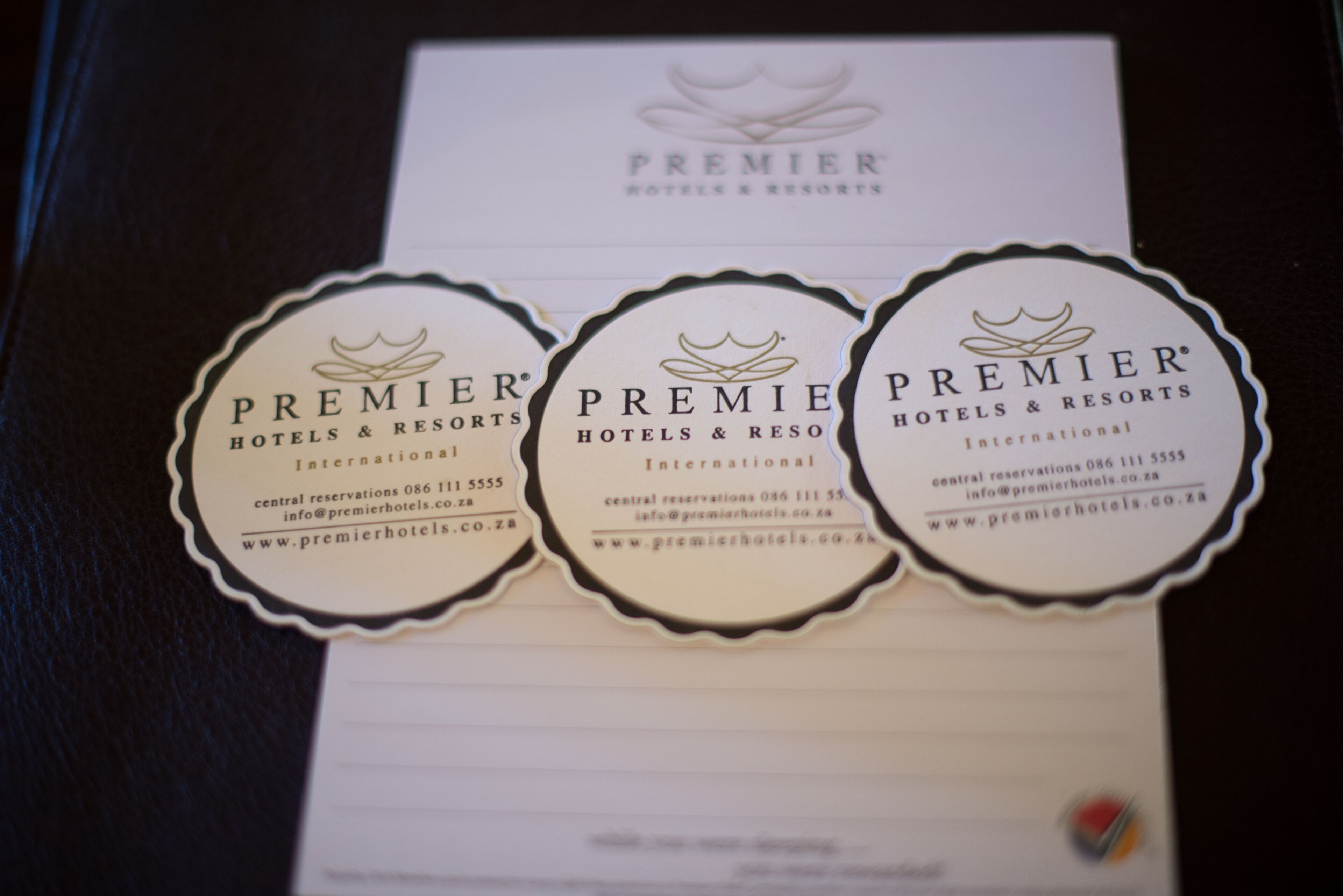 Three business cards for Premier Hotels & Resorts International with contact information and website URL.