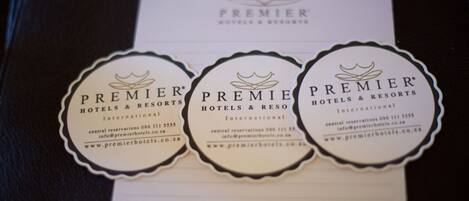 Three business cards for Premier Hotels & Resorts International with contact information and website URL.