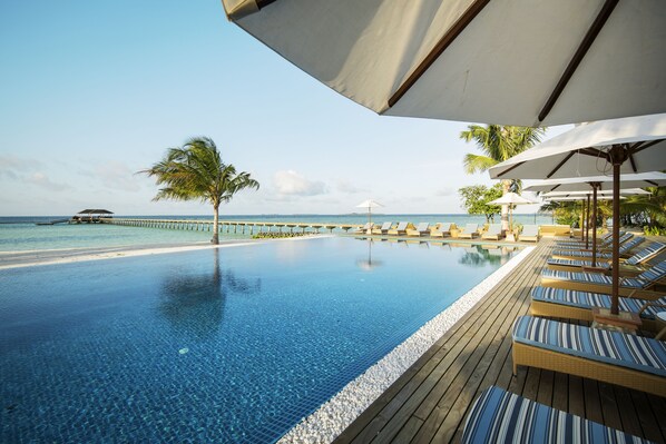 Outdoor pool, pool umbrellas, sun loungers