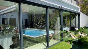 Seasonal outdoor pool, open 3:30 PM to 7:00 PM, pool umbrellas