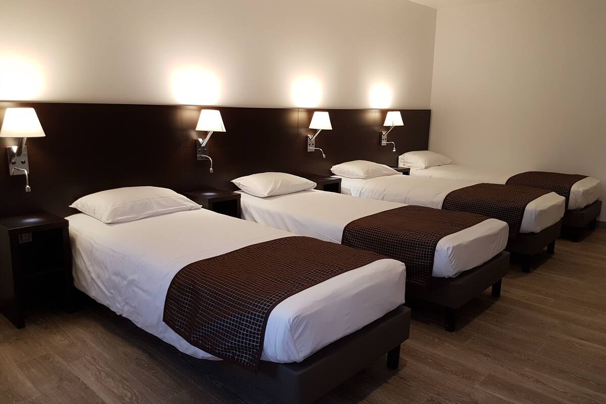 family room | down duvets, pillow-top beds, desk, iron/ironing board