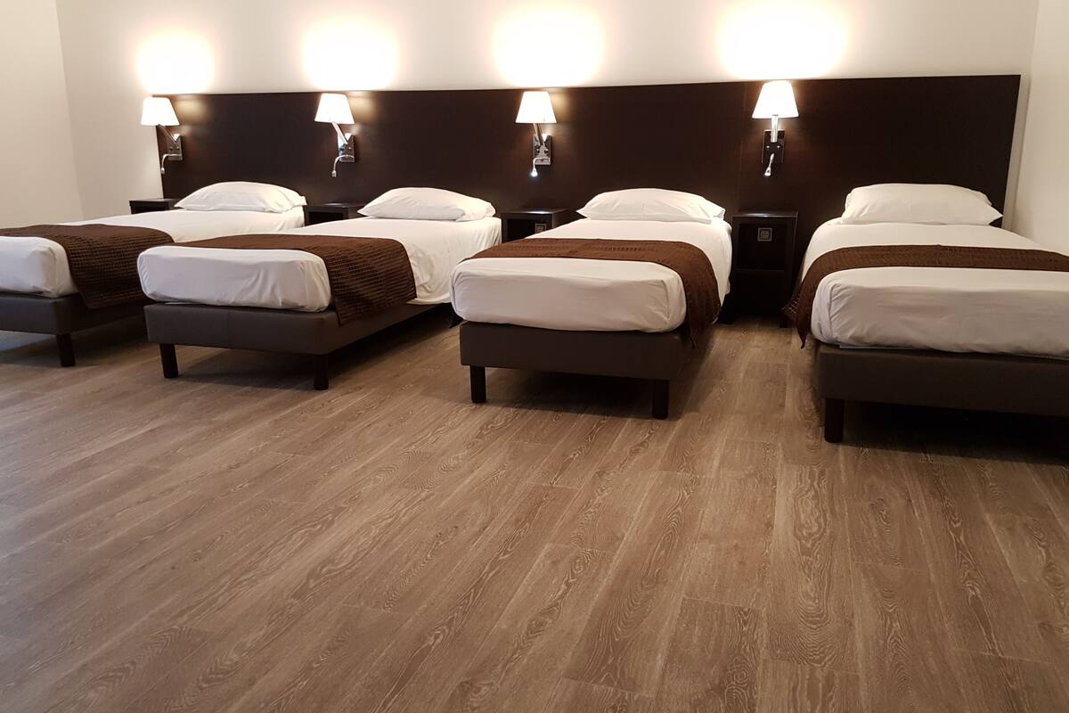 quadruple room | down duvets, pillow-top beds, desk, iron/ironing board