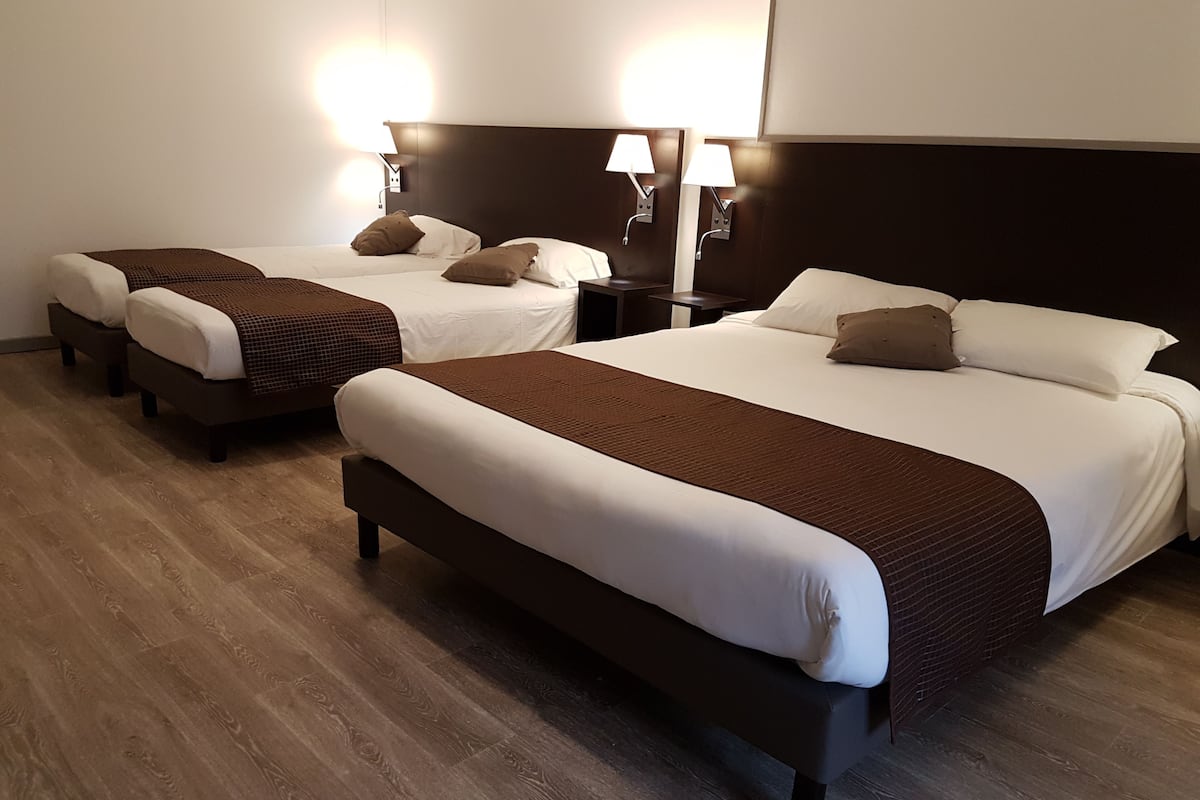 down duvets, pillow-top beds, desk, iron/ironing board