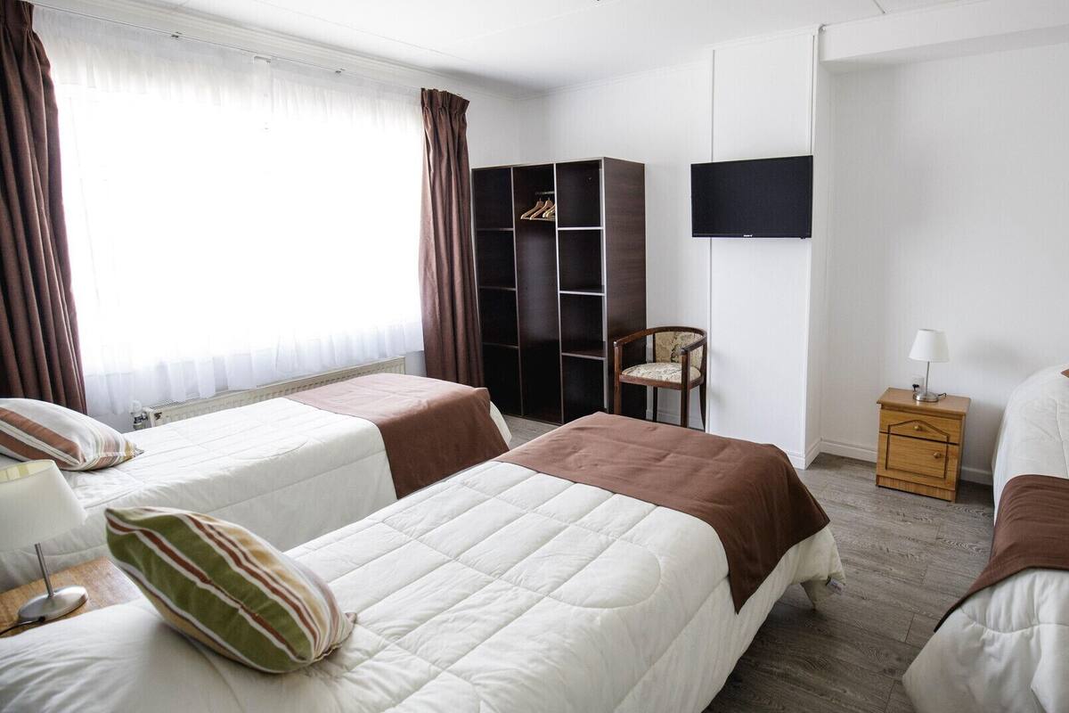 Blackout curtains, iron/ironing board (on request)