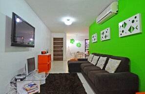 Apartment, 3 Bedrooms | Living area | Flat-screen TV