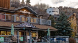 A two-story building with a sign for 'Sipeshouse' and 'Sipesarchectics' on the upper level. - The Bunkhouse - Hostel (Minturn)