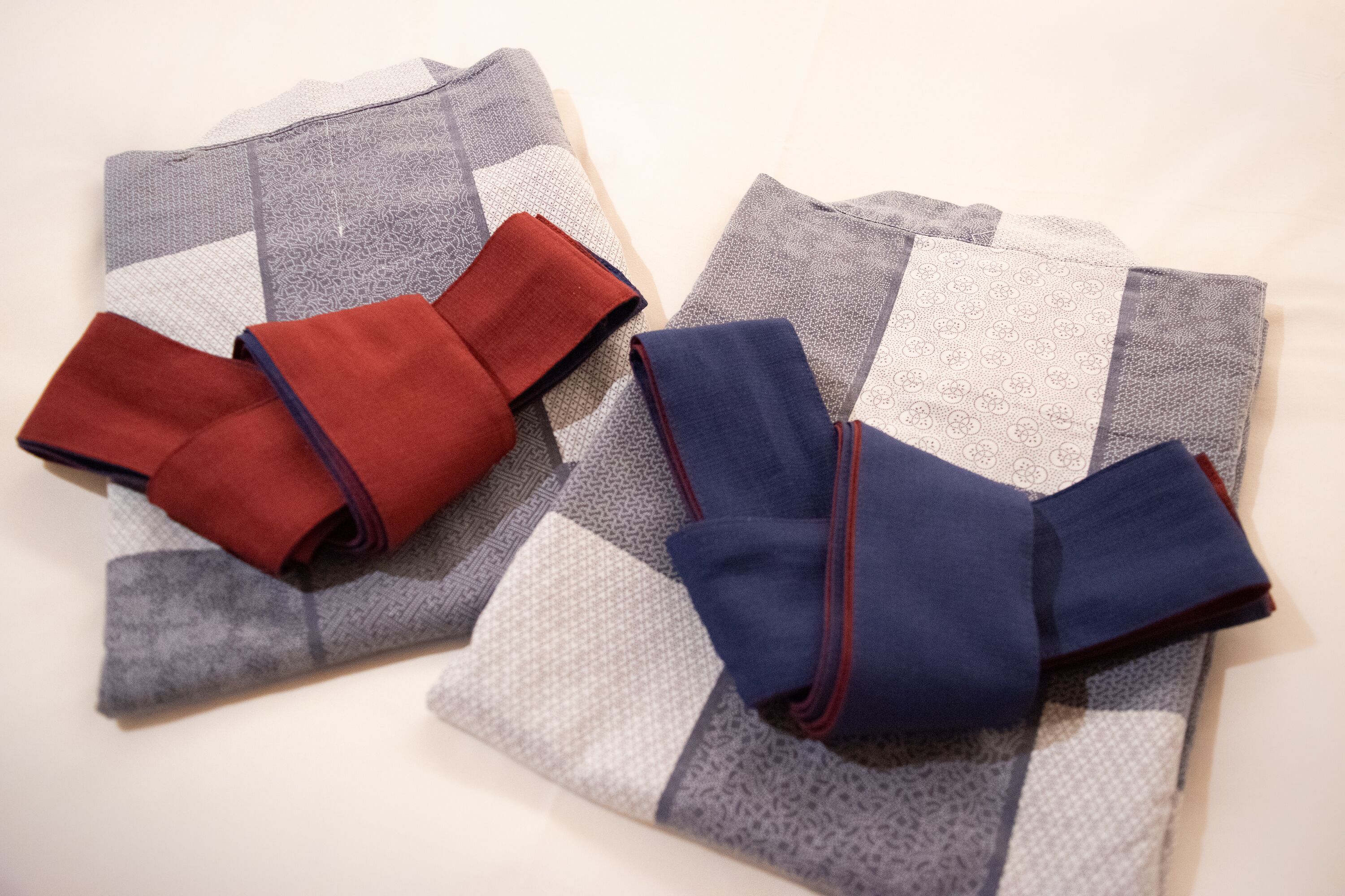Two folded garments with different patterns and colors.