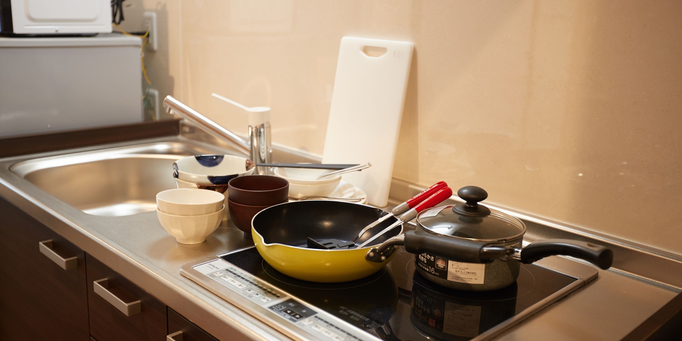 (condominium type) twin room a | private kitchen | microwave, cookware/dishes/utensils