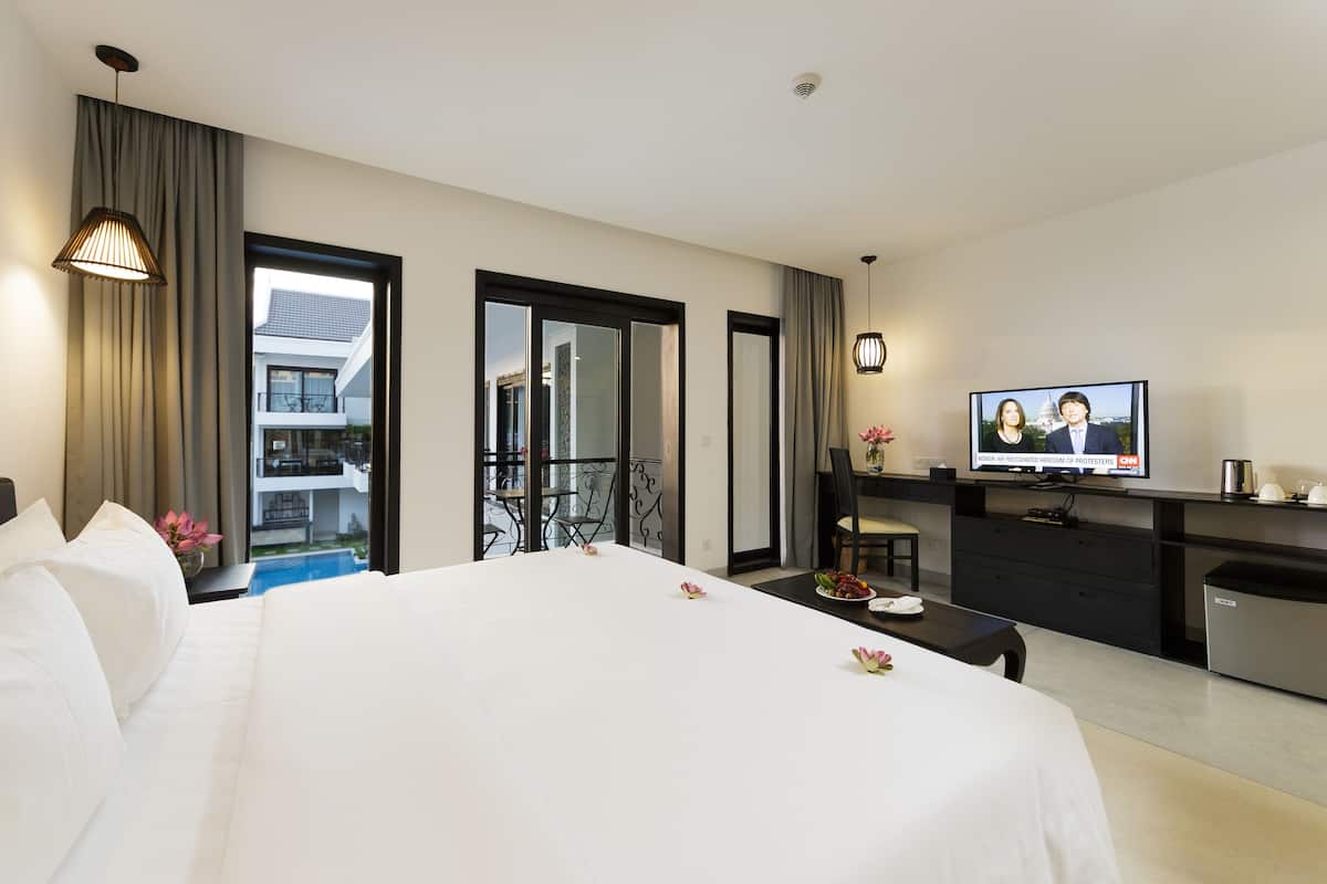 Luxe beddengoed, een minibar, een kluis op de kamer, een bureau