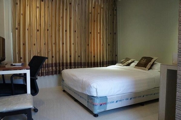 Habitación Deluxe con 1 cama doble o 2 individuales | Minibar, caja fuerte, escritorio y wifi gratis