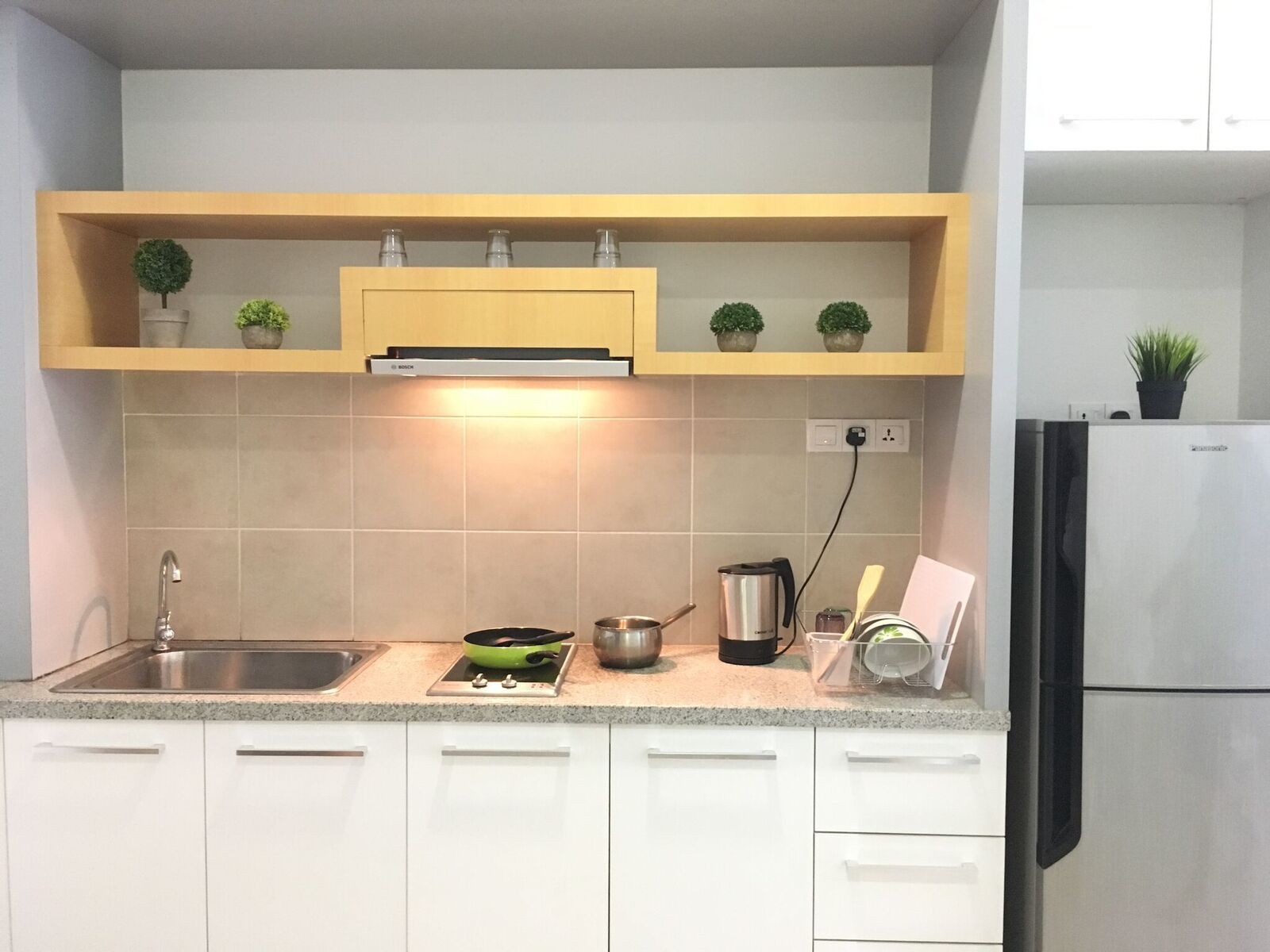 modern design suite | private kitchenette | full-sized fridge, microwave, stovetop, electric kettle