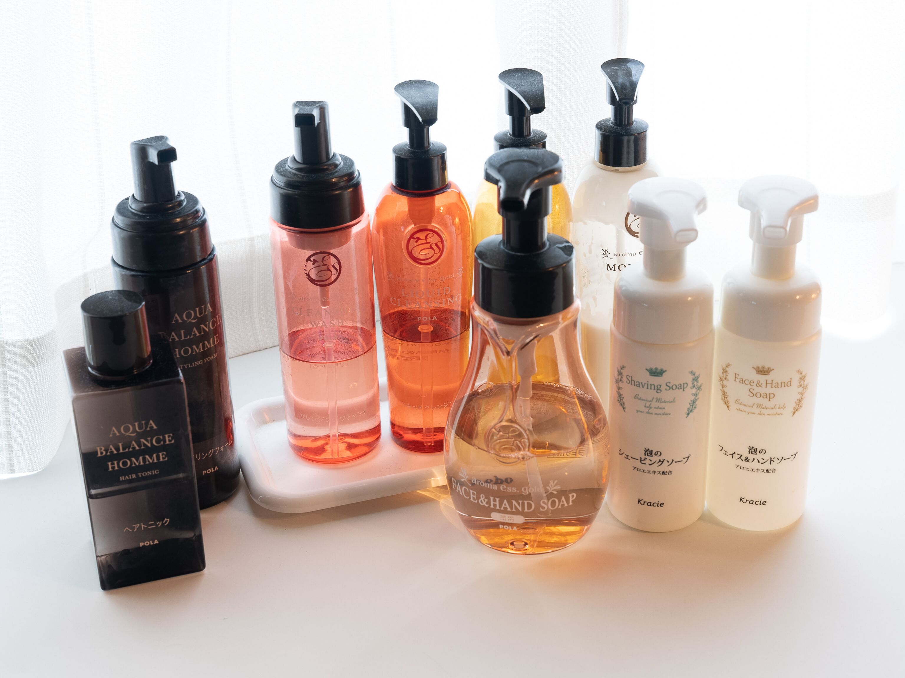 A variety of personal care products arranged on a white surface.