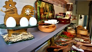A buffet setup with various food items and serving utensils. - Foca 1887 Otel (Foça)