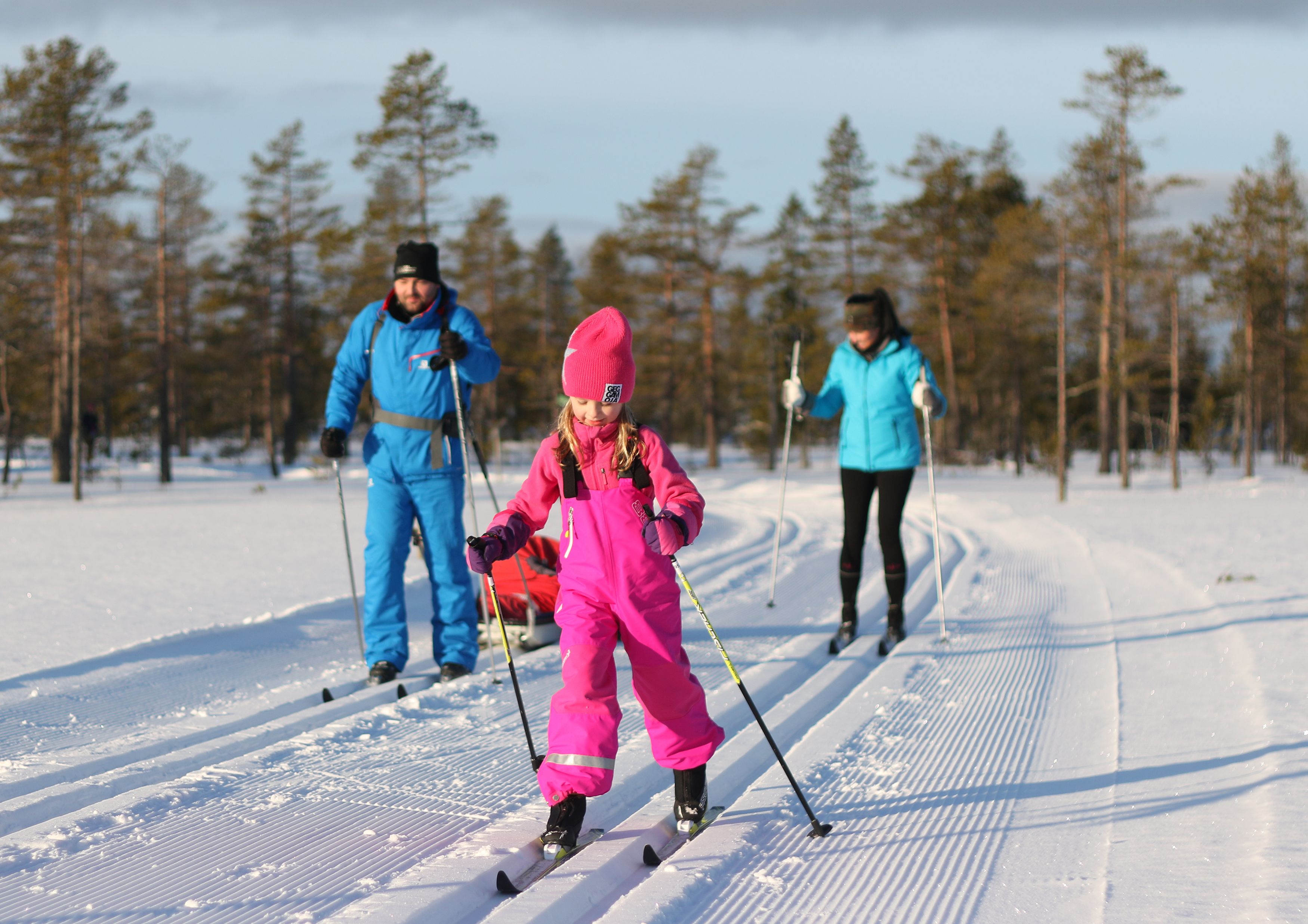 A snowy landscape with skiers.