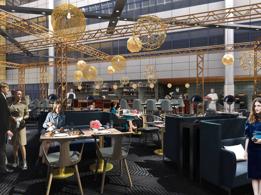 A modern restaurant with high ceilings, geometric chandeliers, and a bar area.