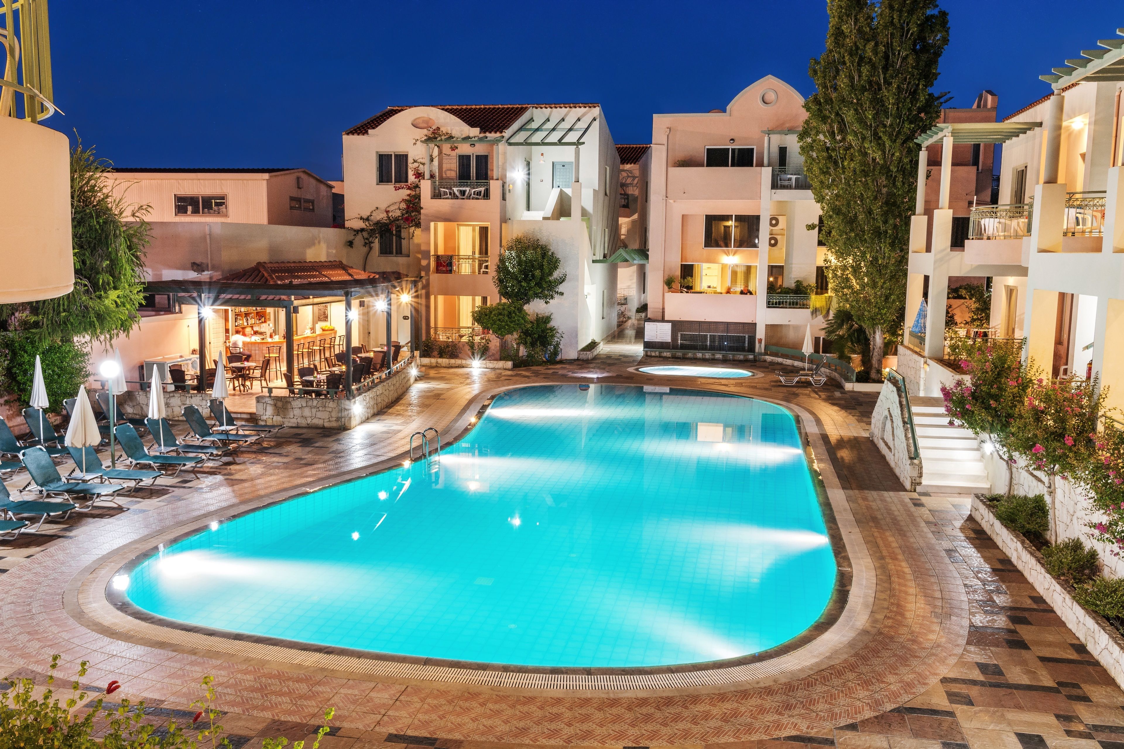 Seasonal outdoor pool, open 10:00 AM to 6:00 PM, pool umbrellas