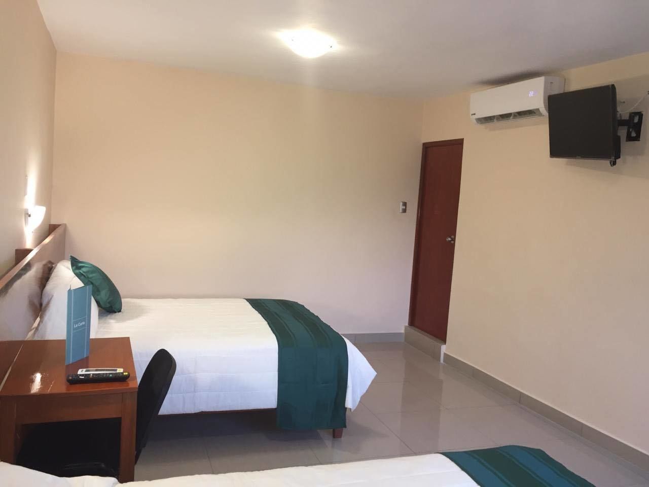 family room, 2 double beds, air conditioning, city view | view from room