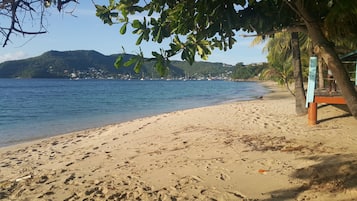 Beach nearby, white sand, beach towels
