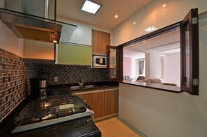 Family Apartment, 3 Bedrooms, Kitchen, Beachside | Private kitchen | Fridge, microwave, oven, coffee/tea maker - LineRio Copacabana Luxury Residence (Rio de Janeiro)