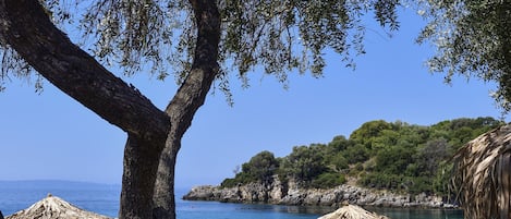 On the beach, sun-loungers, beach umbrellas, beach towels