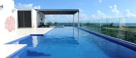 Outdoor pool, a rooftop pool, sun loungers