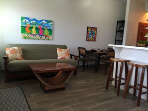 Two-Bedroom Apartment | Living area | 30-inch LED TV with cable channels, TV