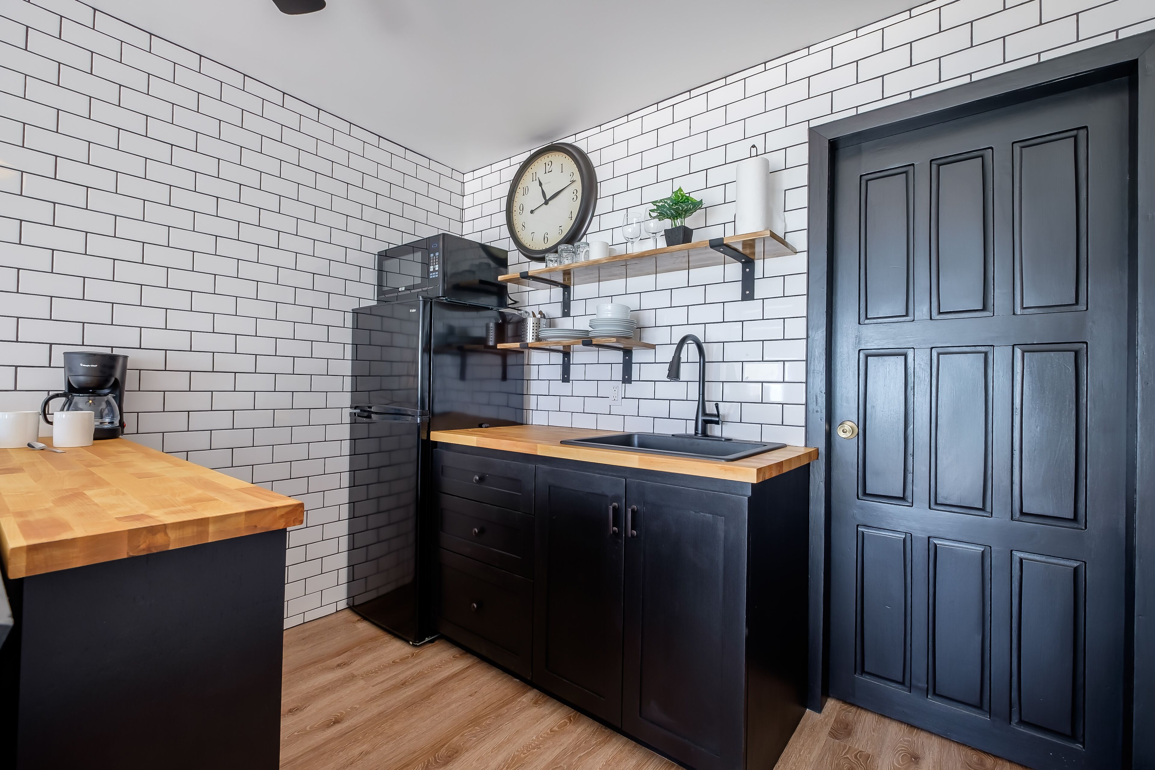 full-sized fridge, microwave, stovetop, coffee/tea maker