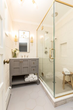 Combined shower/tub, hair dryer, towels, soap