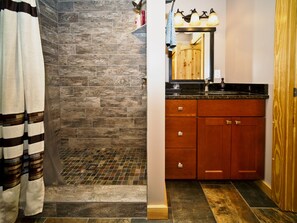 Combined shower/tub, hair dryer, towels, soap