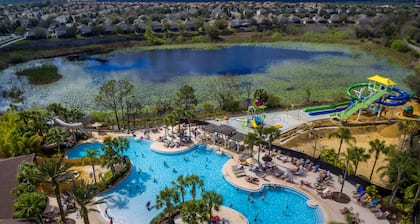 Modern condo in resort, 5 min to Disney. WiFi, water slides, pool, arcade!