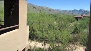 A view of a mountainous landscape with a building in the foreground. - Perfect condo in foothills of the Catalina Mountains with Spectacular Views (Tucson)