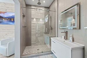 Combined shower/tub, hair dryer, towels, soap