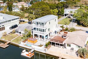 Enjoy waterfront views from the spacious balcony with outdoor seating and access to a dock for water activities.