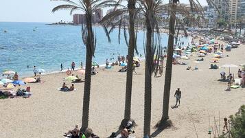 On the beach, sun loungers, beach towels