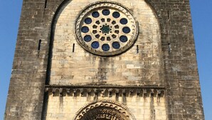 A historic tower with a large circular window and an ornate doorway. - Studio Penthouse La Casa de Manuel, is located in Portomarín, 22km from Sarria. (Portomarín)