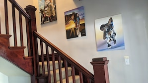 A staircase with wooden railings and carpeted steps. - Walking distance everywhere, yard, front porch and hot tub! (Coeur d'Alene)