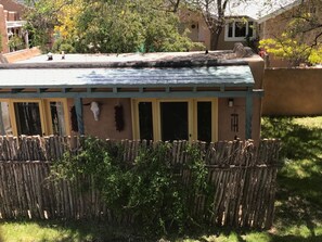 Situated in a residential area, this single-story building features a flat roof and large windows.