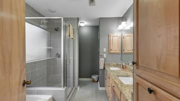Bathtub, hair dryer, towels, soap