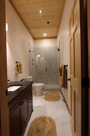 Combined shower/tub, hair dryer, towels, soap