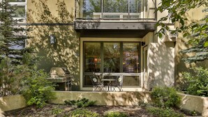 A modern building with a large window, outdoor seating, and a well-maintained garden area. - Modern open concept, close to DT and Free UG Parking. Discounted Monthly Rate. (Calgary)