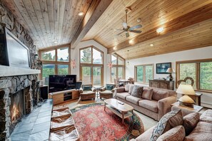 Flat-screen TV, fireplace, ping pong, books