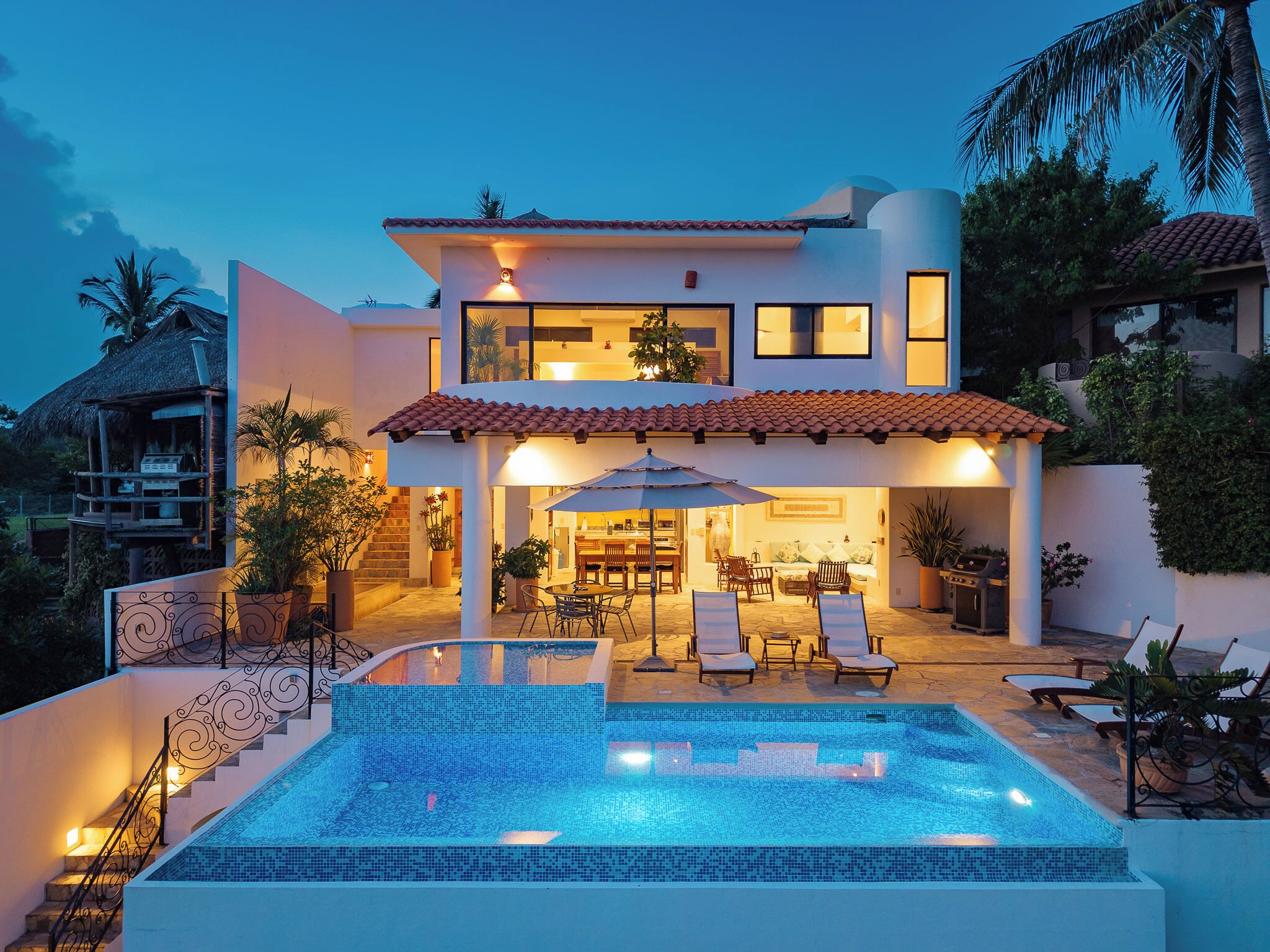 An infinity pool, sun loungers